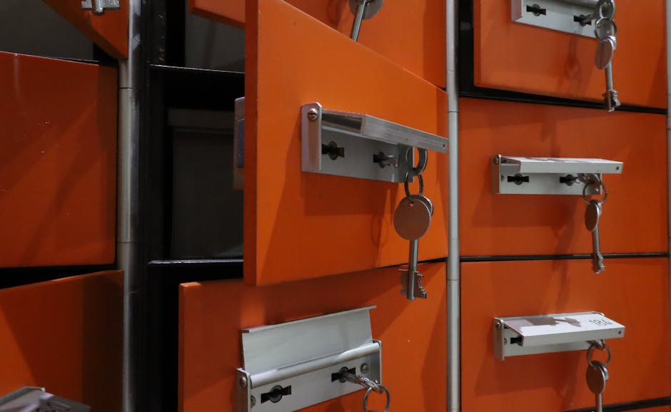 Orange lockers with metal keys highlighted in an indoor setting.