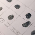 Biometric Integrity: The New Standard for Operational Security Detailed fingerprints on official document, highlighting identity verification process.