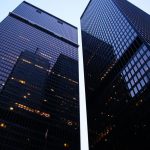 Dramatic low angle view of Toronto's skyscrapers reflecting the evening sky.