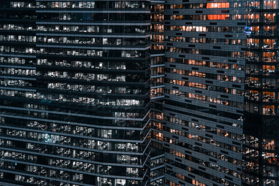 Close-up view of modern office buildings in Moscow, showcasing urban architecture at night.