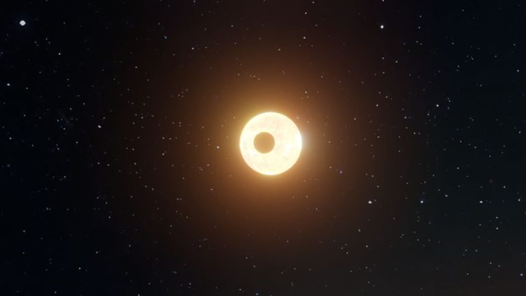 A captivating view of a solar eclipse set amidst a star-filled night sky.