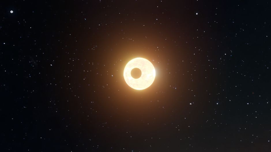 A captivating view of a solar eclipse set amidst a star-filled night sky.