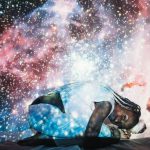 Artistic double exposure of a woman with a cosmic galaxy background, creating a dreamy and ethereal effect.