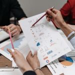Data Sovereignty: A Strategic Asset for Modern Enterprises Team analyzing business reports and charts during a collaborative meeting.