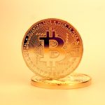 Decentralized Production: Scaling Strategy for Modern Business A close-up of a golden Bitcoin highlighting its digital currency design.