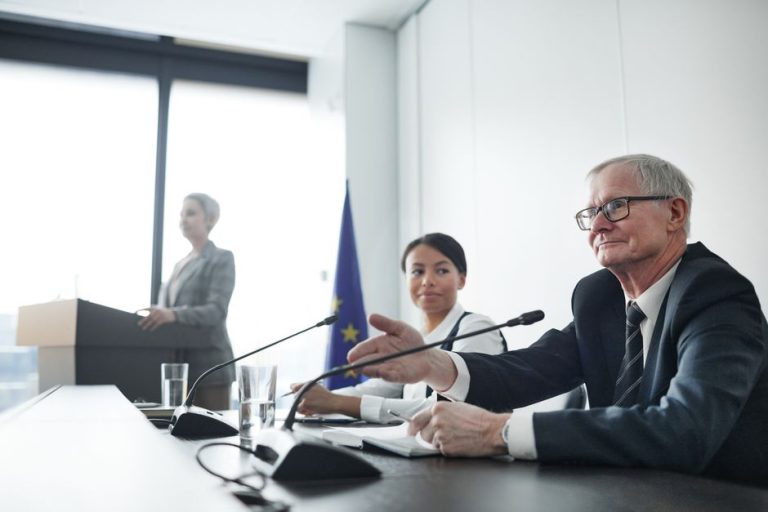 Panelists at an EU conference discussing law and diplomacy.