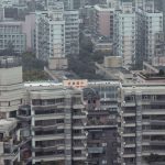 Aerial view showcasing dense high-rise buildings in an urban downtown district.
