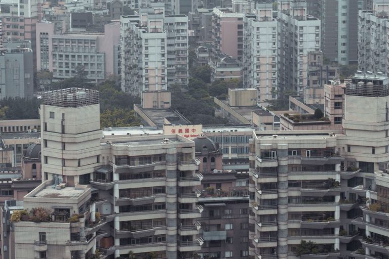 Aerial view showcasing dense high-rise buildings in an urban downtown district.