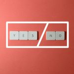 Creative concept of decision making with YES and NO keys on a red background.