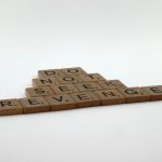 Wooden letter tiles on white background spelling 'DO NOT SEEK REVENGE'.