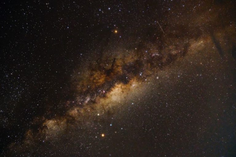 Captivating photograph of the Milky Way galaxy displaying vivid stars and interstellar clouds.