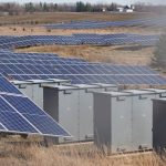 Grid-Scale Energy Storage: Strategic Advantage for Leaders Expansive solar panel field in a rural area harnessing solar energy. Sustainable and renewable energy source.