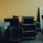 <title>Hannibal Mejbri: A Case Study in High-Stakes Performance</title> Many boxes and huge iron cases near umbrella placed in room with yellow walls