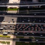 High angle view of busy traffic on Dubai highway, featuring cars and elevated roads.