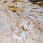 Stunning aerial shot of a marble quarry in Thessaloniki, Greece showcasing the intricate patterns and colors.
