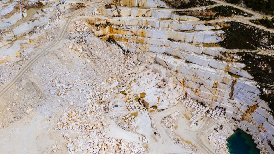 Stunning aerial shot of a marble quarry in Thessaloniki, Greece showcasing the intricate patterns and colors.