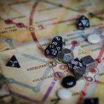 A vibrant board game scene featuring dice and a colorful map layout.