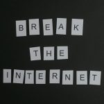 Memetic Immunity: Why the Best Leaders Are Now Strategic Iconoclasts Conceptual flat lay of 'Break the Internet' message with white letters on a black background.