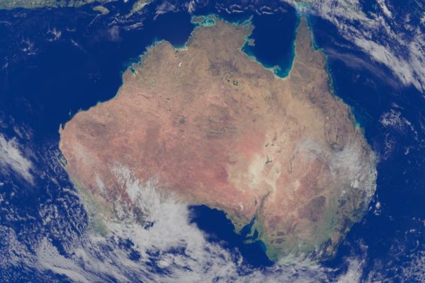 Stunning satellite image capturing Australia surrounded by deep blue ocean waters.