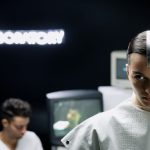 Woman in a futuristic laboratory with high-tech atmosphere.