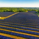Aerial view of a vast solar farm in Red Wing, MN, generating renewable energy.