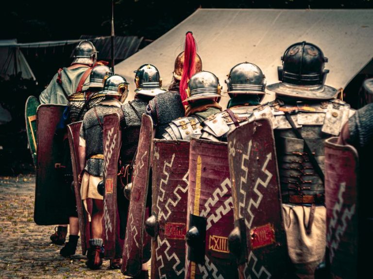 Reenactors in Roman legion outfits march in a historical festival in Wrocław, Poland.
