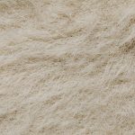 Synthetic Materials: The Secret to Modern Operational Strategy High-resolution close-up of a textured surface with beige natural fibers forming intricate patterns.