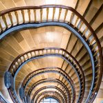 The Academic Trap: Why 'Being Right' is Destroying Your Decision-Making Velocity Intricate spiral staircase captured from above in a Hamburg building showcasing elegant curves.