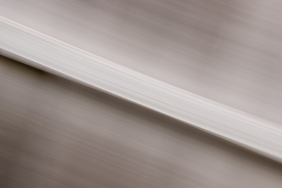 Abstract image featuring blurred motion with a white textured pattern.