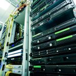 High-tech server rack in a secure data center with network cables and hardware components.