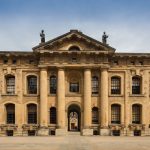 Front view of the Clarendon Building, a historic landmark at Oxford University.