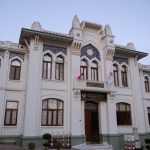 Facade of Fatih Sultan Mehmet University in Istanbul, showcasing Ottoman architectural design.