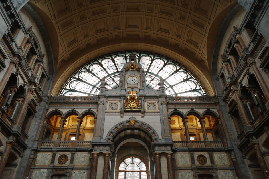 Interior view of Antwerp Central Station showcasing its majestic architectural beauty.