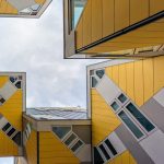 Geometric perspective looking up at the famous Cube Houses in Rotterdam, Netherlands.
