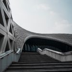The Architecture of Inertia: Overcoming Institutional Friction Striking modern architecture with geometric patterns and a dynamic facade.