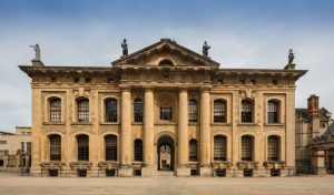 Front view of the Clarendon Building, a historic landmark at Oxford University.