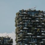 Modern building with vertical greenery, showcasing sustainable urban architecture.
