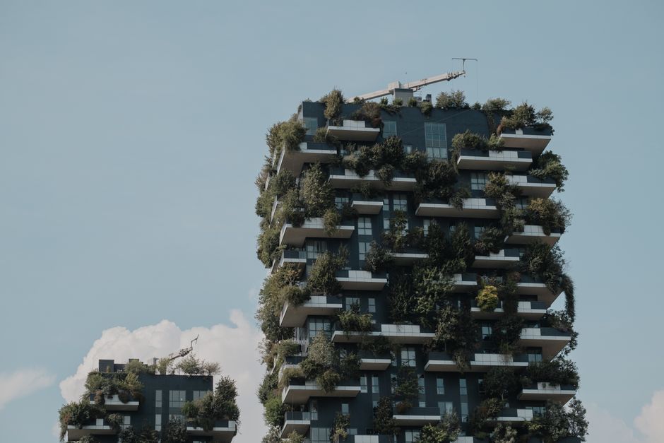 Modern building with vertical greenery, showcasing sustainable urban architecture.