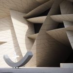 The Architecture of Subversion: Challenging Corporate Hegemony Explore the innovative geometric design of the National Museum of Qatar, capturing unique shadow play.