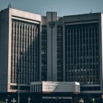 The Collapse of Centralized Authority: Mastering Decentralization Front view of a striking government building in Ukraine under a clear sky.