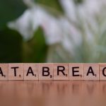 The Compliance Trap: Privacy Legislation as a Strategic Pivot Close-up of Scrabble tiles spelling 'data breach' on a blurred background