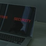 The Death of Computational Security: Quantum Risk Strategy Close-up of a laptop displaying cybersecurity text, emphasizing digital security themes.