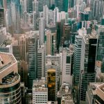 The Economics of Urban Density: A Strategic Business Asset Breathtaking aerial view of Hong Kong's high-rise buildings and urban skyline.