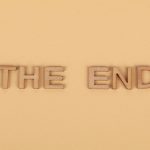 The End of Physical Proximity: Strategic Tele-presence Guide Wooden letters spelling 'The End' on a plain beige background, perfect for endings.