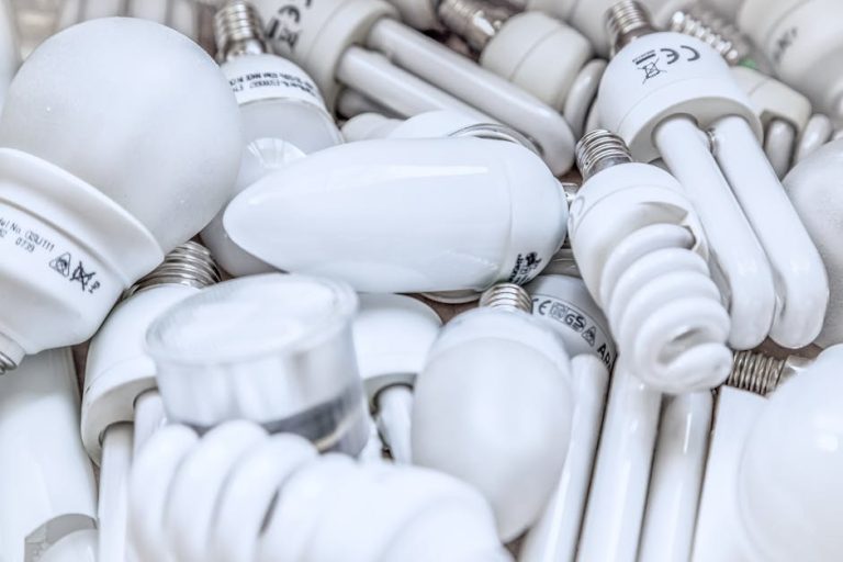Pile of diverse energy-efficient light bulbs showcasing an array of designs and functionalities.