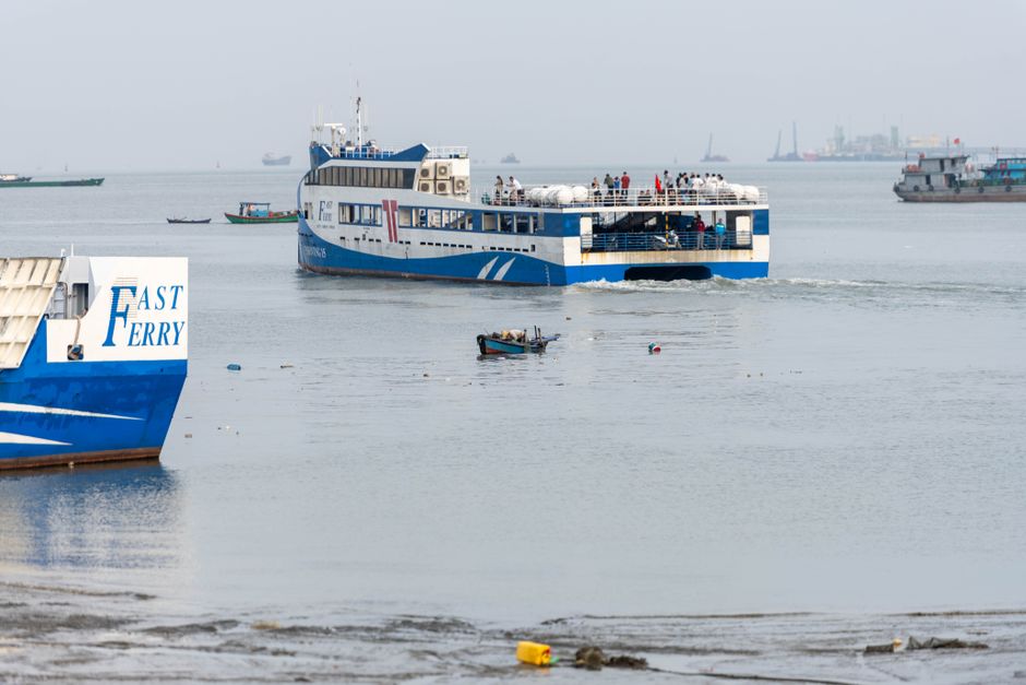 A bustling ferry with passengers departing from Vũng Tàu harbor in Vietnam.