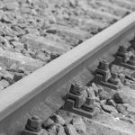 The Friction of Abundance: Why Constraints Are Your Greatest Creative Asset Artistic black and white photo of a railway track showing details of rails and gravel.