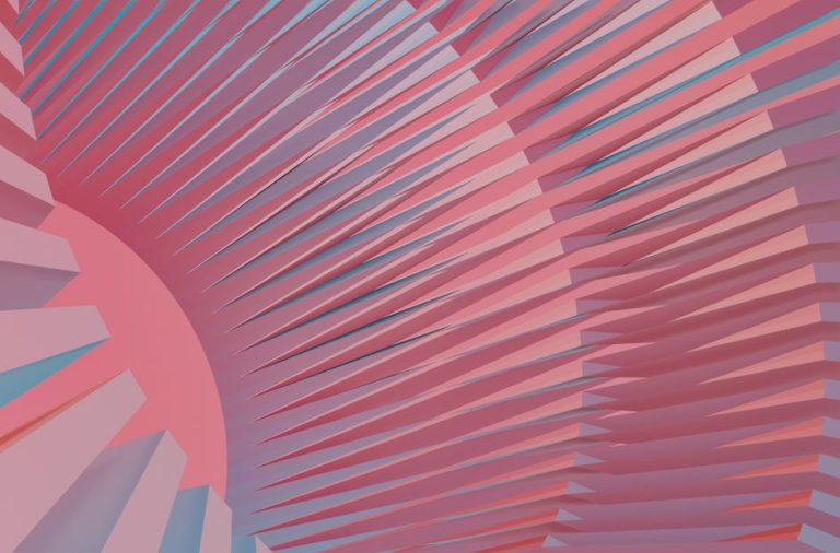 Creative abstract composition with pink and blue geometric shapes forming a radial pattern.
