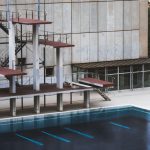 The Invisible Architecture of Competitive Advantage: Materials Empty swimming pool with diving platforms in Barcelona, showcasing urban decay.
