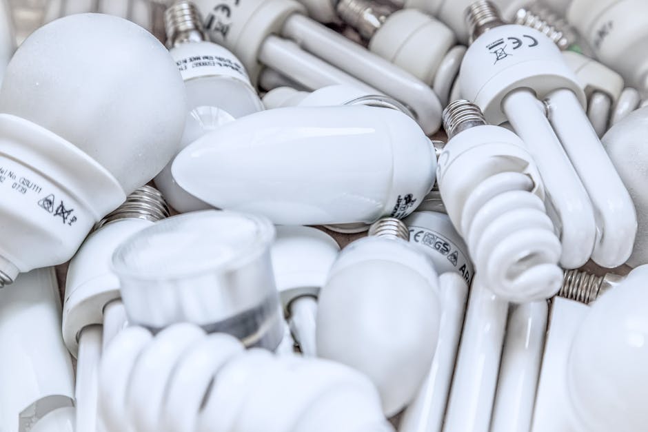 Pile of diverse energy-efficient light bulbs showcasing an array of designs and functionalities.